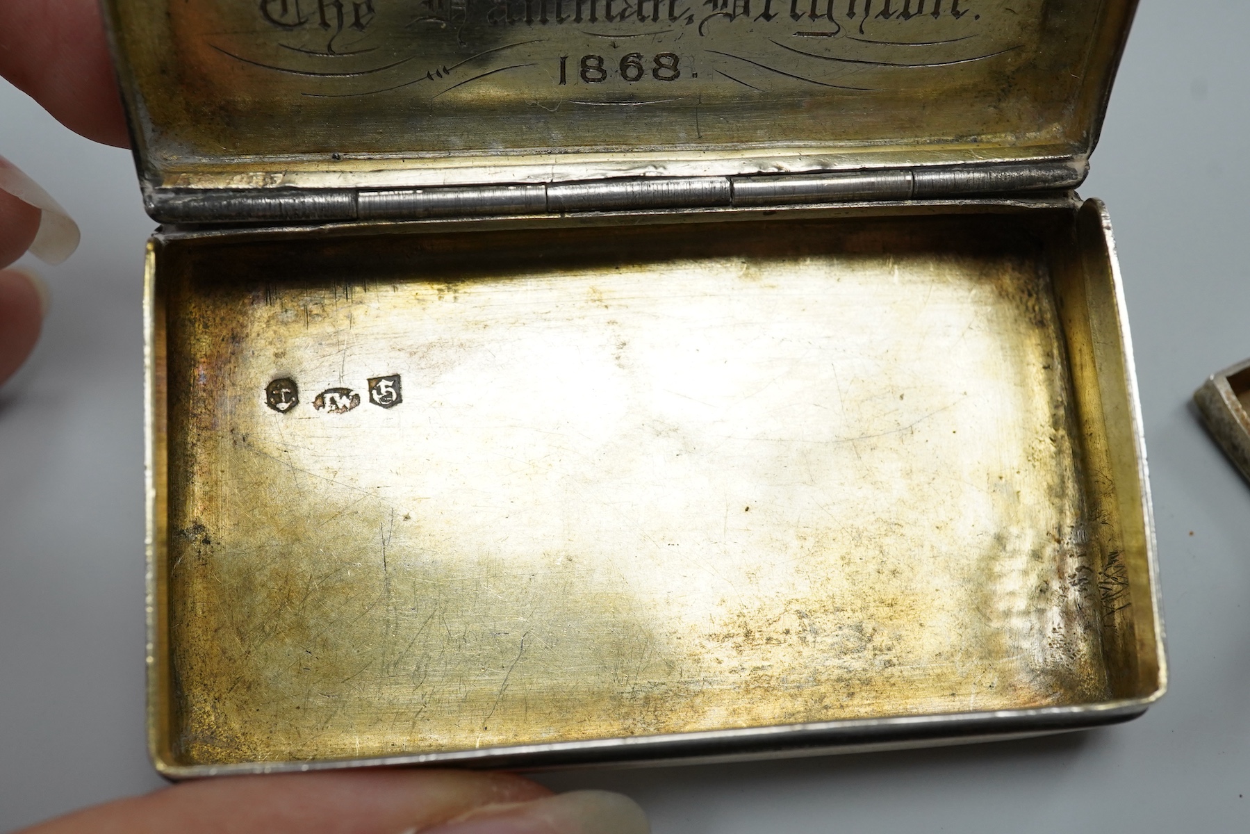 A William IV engine turned silver rectangular snuff box, by Joseph Wilmore, Birmingham, 1830, with later engraved inscription dated 1868 relating to a Turkish Baths in Brighton, known as The Hamman, 74mm, together with o